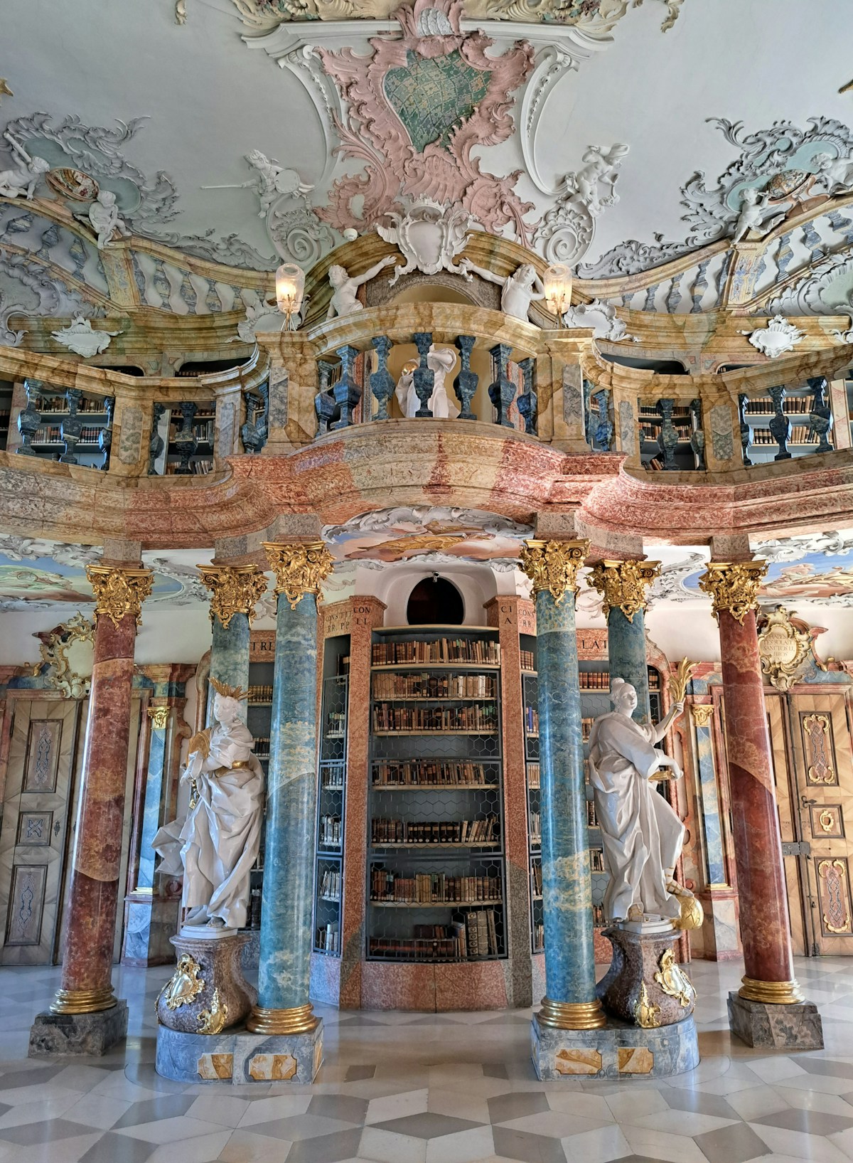 Books, sculpture and painted columns in the library at Wiblingen